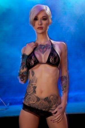 Hot tattooed Kleio Valentien sheds black lace panties to squat & spread legs on leakfanatic.com