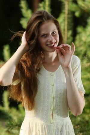 Pale girl with long red hair Nicole K gets totally naked amid saplings on leakfanatic.com