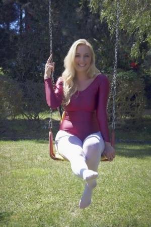 Busty blonde Hayley Marie Coppin strips bodysuit and white pantyhose outdoors on leakfanatic.com