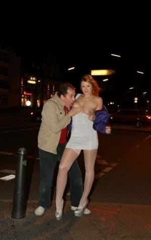 Slutty LaMia in white stockings topless sucks on her knees in the street on leakfanatic.com