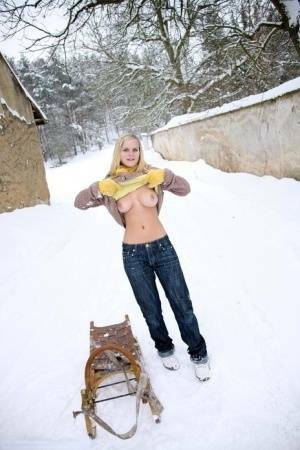 Busty blonde bares big tits in the snow & sucks POV for mouthful of cum on leakfanatic.com