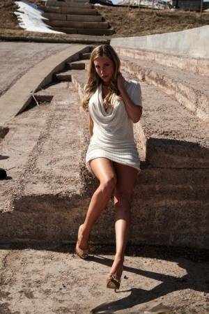 Hot blonde in white dress flashes pierced tits & naked pussy upskirt outdoors on leakfanatic.com