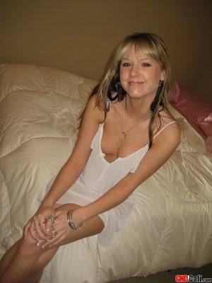 Cute teen Cali strips out of her little white nighty on leakfanatic.com