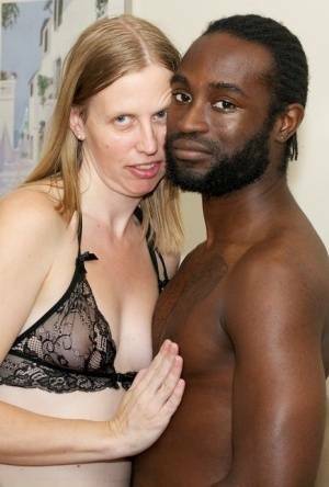 White amateur deepthroats her black lover's cock in lingerie ensemble on leakfanatic.com