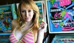 Brett Rossi fingers her pussy in striped OTK socks atop pinball machine on leakfanatic.com