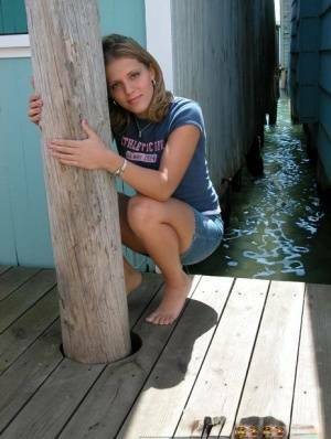 Blonde solo girl flashes upskirt panties on lakeside boardwalk on leakfanatic.com