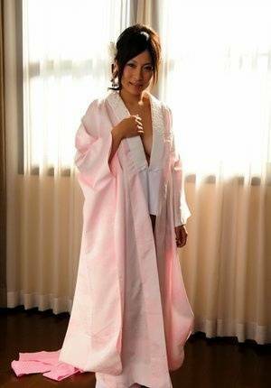 Japanese solo girl slips off her robe to reveal her nice boobs in white socks - Japan on leakfanatic.com