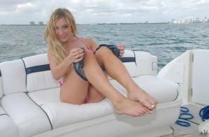 Lusty blonde Amy Brooke strips bikini and rubs pussy on the boat on leakfanatic.com