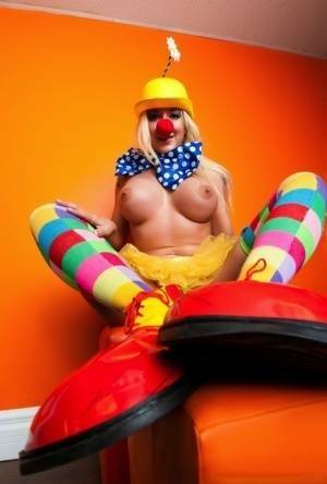 Hot cosplay MILF Leya Falcon in clown costume fondling her huge big tits on leakfanatic.com