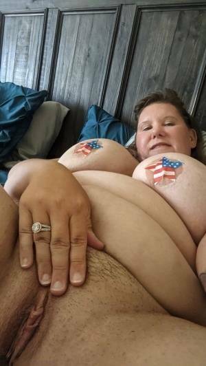 Overweight amateur Busty Krisann poses in the nude around her home on leakfanatic.com