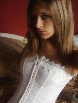 Teen in white corset and tight panties showing off her perfect tight body on leakfanatic.com