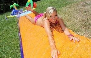 Young blonde Ally Kay ends a water fight by having sex in backyard on leakfanatic.com