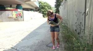 White girl pulls down her panties before squatting for a piss on country road on leakfanatic.com