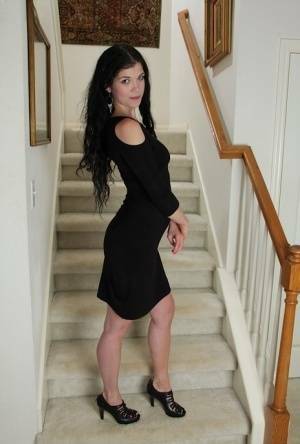 Clothed milf beauty Veronica Stewart is taking off her black dress on leakfanatic.com