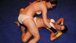 Adorable lesbians are into hot nude wrestling in the ring on leakfanatic.com