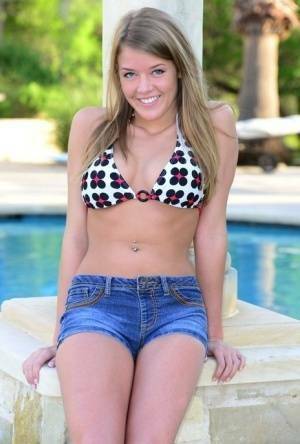 Cute teen Sophia Wood drops her shorts by the pool to toy with a vibrator on leakfanatic.com