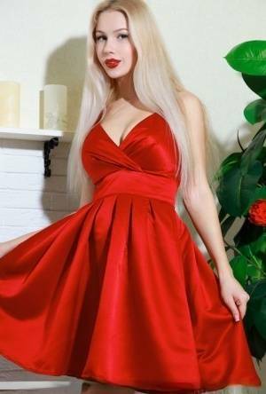 Nice blonde teen Genevieve Gandi removes red dress to display her trimmed muff on leakfanatic.com