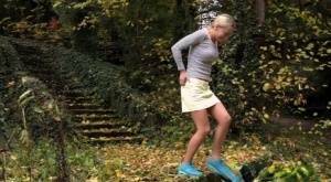 Cute blonde Victoria Pure hikes her skirt to take a pee along country lane on leakfanatic.com