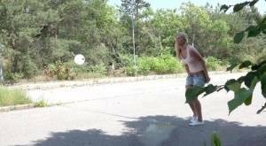 Blonde female Nikki Dream can't hold her pee any longer and squats on roadway on leakfanatic.com