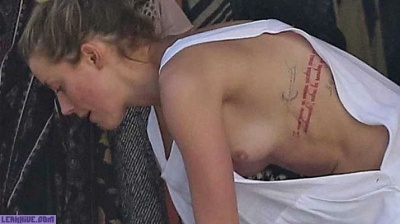 Amber Heard caught topless on the beach on leakfanatic.com