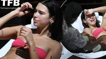 Dua Lipa Wears a Hot Pink Bikini as She Relaxes by the Pool with a Mystery Man in Miami on leakfanatic.com