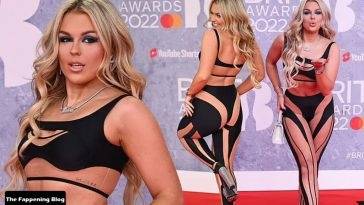 Tallia Storm Flaunts Her Sexy Figure in a Risqué Black Top and Cutout Trousers at The BRIT Awards on leakfanatic.com