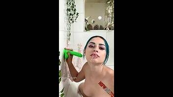 Jewelz Blu sucking a neon green dildo in the tub onlyfans porn videos on leakfanatic.com