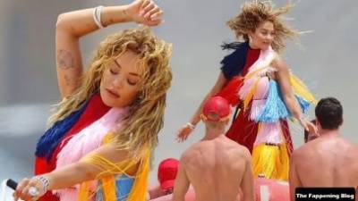 Rita Ora Wears a Bright Dress as She Does a Sexy Shoot at Maroubra Beach on leakfanatic.com