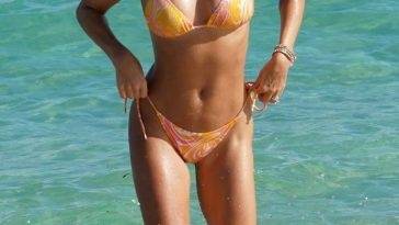 Sylvie Meis Rocks a Skimpy Orange Bikini at the Beach in Miami on leakfanatic.com