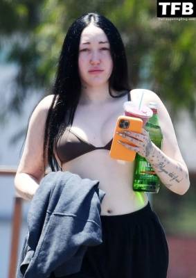 Noah Cyrus Slips Into a Bikini Top Cooling Off From the Sweltering Heat with Her Boyfriend in LA on leakfanatic.com