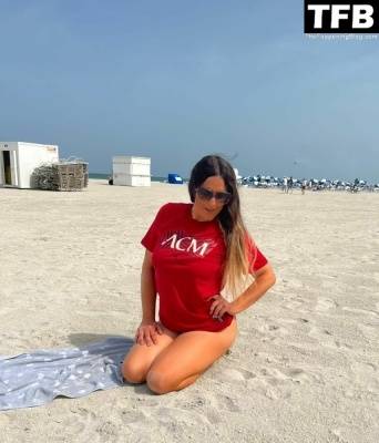 Claudia Romani Supports AC Milan on the Beach in Miami on leakfanatic.com