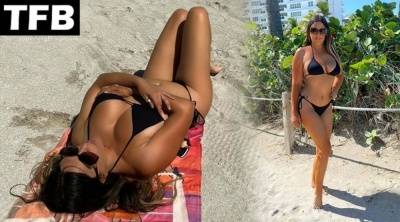 Claudia Romani Shows Off Her Curves on the Beach on leakfanatic.com