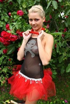 Cute blonde teen Buffy hikes up a tutu before masturbating in the back yard on leakfanatic.com