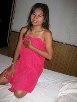 Petite Thai girl washes up her shaved pussy after bareback sex with a tourist - Thailand on leakfanatic.com