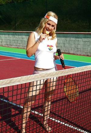 Sporty babe with big tits Angel B toying her cunt on the tennis court on leakfanatic.com