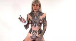 Tattoo enthusiast Amber Luke rides a multispeed sex machine on leakfanatic.com