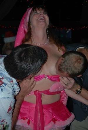 Mature lady Dee Delmar and friends hit the swing club for Christmas orgy on leakfanatic.com