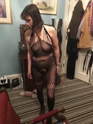 Older amateur Slut Scot Susan shows her beaver on a bed in a bodystocking - Scotland on leakfanatic.com