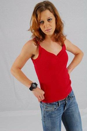 Natural redhead Sabine shows off her black G-shock watch while fully clothed on leakfanatic.com