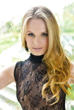 Blonde babe model Jillian Janson strutting outdoors in black bodystocking on leakfanatic.com