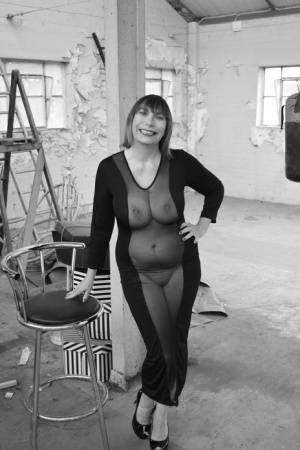 Middle-aged woman Barby Slut models a see-thru dress for a black-and-white gig on leakfanatic.com