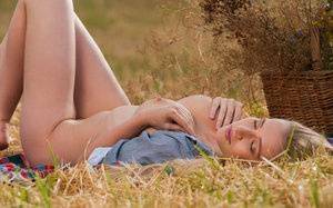 Blonde teen Penelope G displays her great body in a freshly cut farmer's field on leakfanatic.com