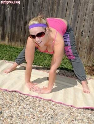 Blonde chick Dee Siren frees her huge ass from yoga pants outdoors on yoga mat on leakfanatic.com