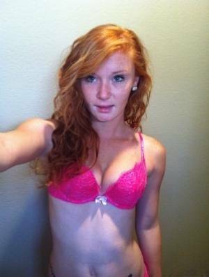 Natural redhead Alex Tanner slips off her pink lingerie set for nude selfies on leakfanatic.com