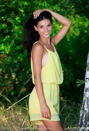 Nice teen Aleksandrina exposes her tan lined body by a hardwood tree on leakfanatic.com