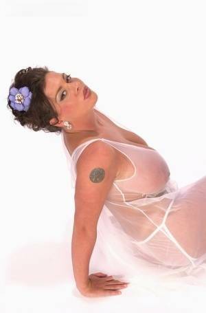 Buxom Linsey Dawn poses to flaunt her droopy tatas in sheer lingerie on leakfanatic.com