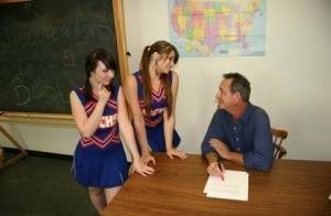 2 cheerleaders jerk off their geography teacher on top of his desk on leakfanatic.com