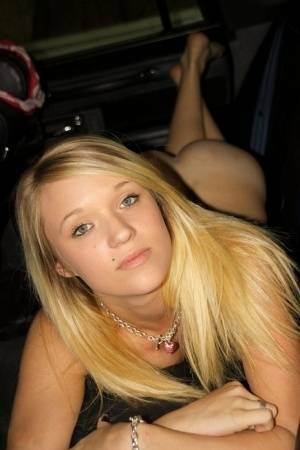 Blonde amateur Teagan slides lace panties aside to get naked inside a vehicle on leakfanatic.com