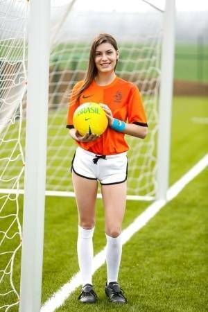 Lilly P is undressing her soccer uniform while on the field with a ball on leakfanatic.com