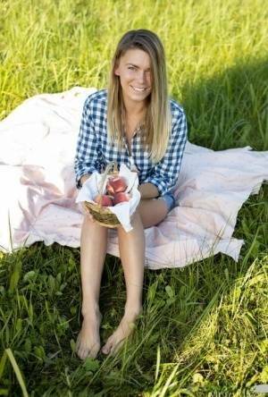 Nice teen Paulina gets completely naked on a blanket in a field on leakfanatic.com